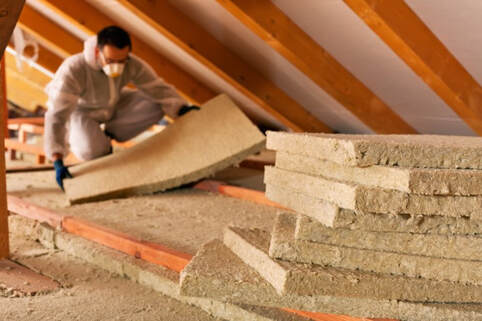 installing attic insulation - Keller, TX